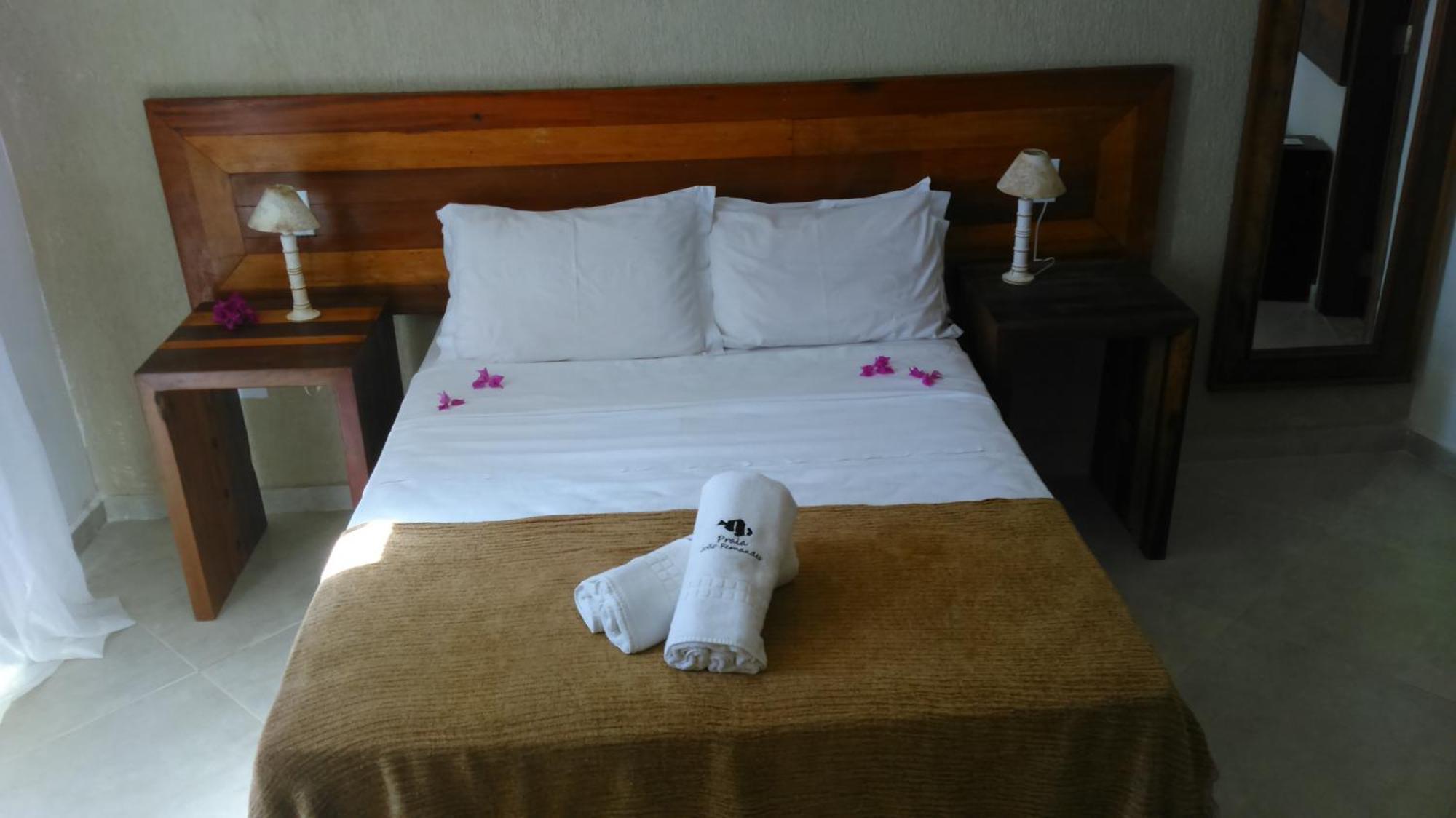 Pousada Praia João Fernandes Búzios Exterior foto A bed in a hotel room
